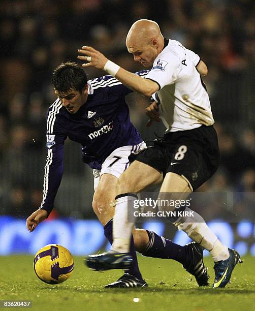 Newcastle's English Midfielder Joey Barton vies with Fulham's English Striker Andy Johnson during their Premier League match against Fulham at Craven...