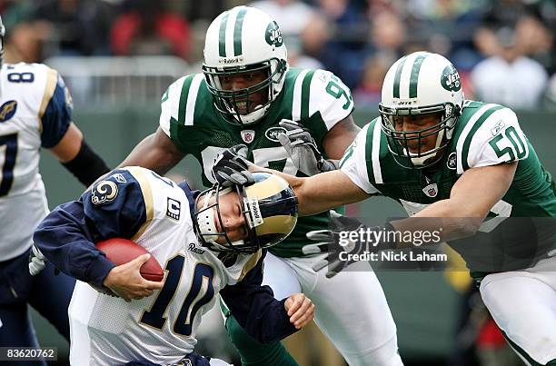 Calvin Pace and Eric Barton of the New York Jets sack Marc Bulger of the St. Louis Rams at Giants Stadium on November 9, 2008 in East Rutherford, New...