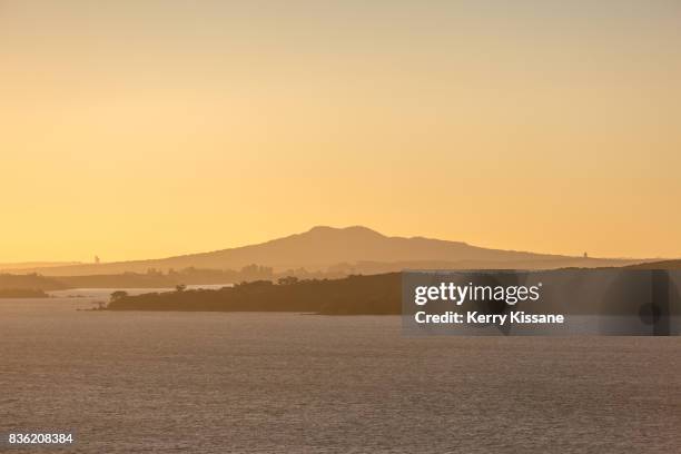 rangitoto island at sunset - waiheke island stock pictures, royalty-free photos & images