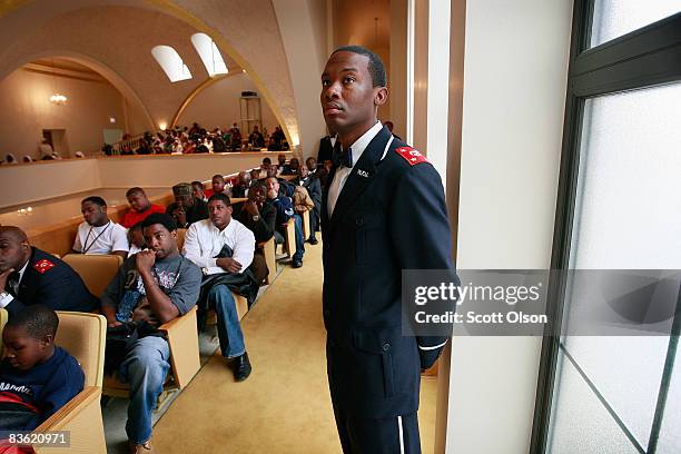 Nation of Islam members listen to a speech by Minister Louis Farrakhan at Mosque Maryam November 09, 2008 in Chicago, Illinois. During his address...