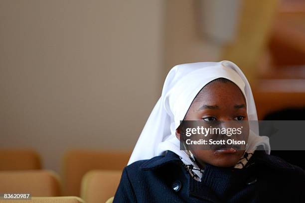 Nation of Islam member listens to a speech by Minister Louis Farrakhan at Mosque Maryam Novermber 09, 2008 in Chicago, Illinois. During his address...