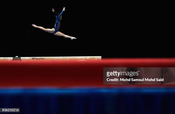 Ma Cristina Onofre of Philppines competes in the team artistic gymnastic balance beam qualifications team final event during the 29th Southeast Asian...