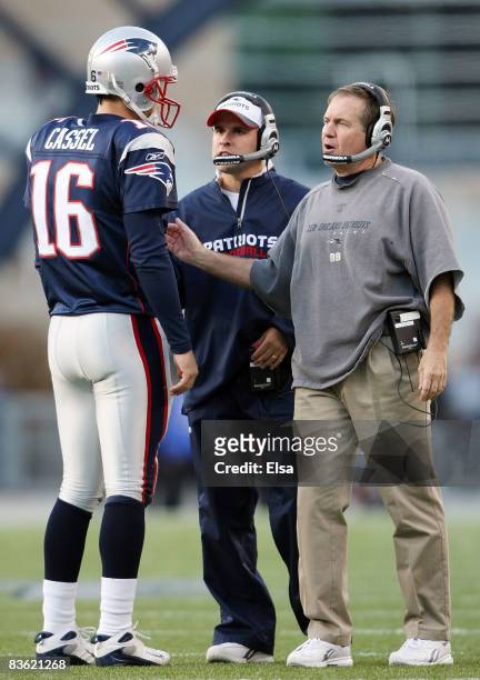 Head coach Bill Belichick and offensive coordinator Josh McDaniels talks with Matt Cassel of the New England Patriots during a time out in the fourth...