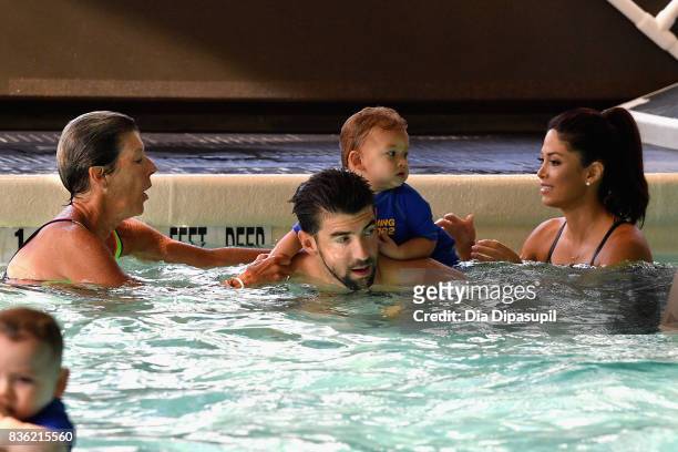 Cathy Bennett, Michael Phelps, Boomer Phelps and Nicole Phelps attend the Huggies Little Swimmers #trainingfor2032 Swim Class With The Phelps...