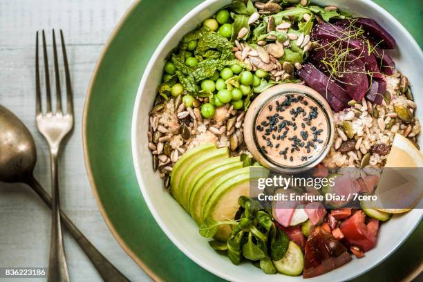 grain bowl with peanut sauce - quinoa and chickpeas stock pictures, royalty-free photos & images