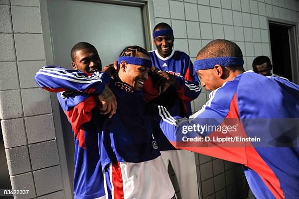 Jason Maxiell, Kwame Brown, and Richard Hamilton greet Allen Iverson of the Detroit Pistons at his first home game against the Boston Celtics on...