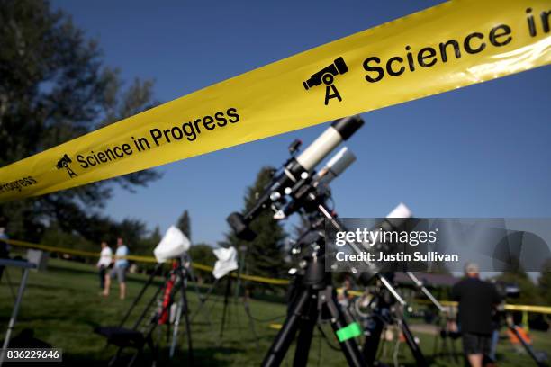 People set up cameras and telescopes as they prepare to watch the total eclipse at South Mike Sedar Park on August 21, 2017 in Casper, Wyoming....