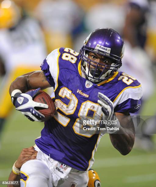 Adrian Peterson of the Minnesota Vikings carries the ball during an NFL game against the Green Bay Packers at the Hubert H. Humphrey Metrodome, on...