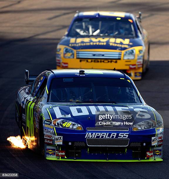 Jimmie Johnson, driver of the Lowe's Chevrolet, leads Jamie McMurray, driver of the IRWIN Industrial Tools Ford during the NASCAR Sprint Cup Series...