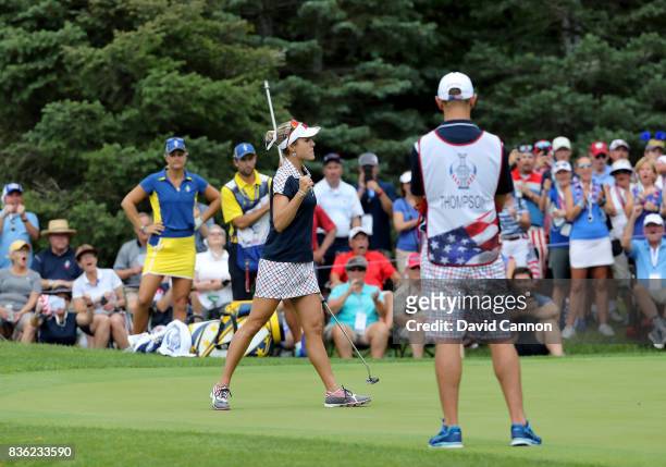 Lexi Thompson of the United States team plays her celebrates holing an birdie putt to win the 16th hole in her match against Anna Nordqvist of Sweden...
