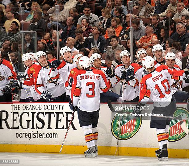 David Booth of the Florida Panthers celebrates a hat trick in the second period with his teammates against the Anaheim Ducks during the game on...