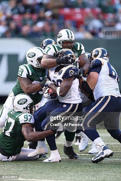 Nose Tackle Kris Jenkins and Linebacker Calvin Pace of the New York Jets make a stop against the St. Louis Rams on November 9, 2008 at Giants...