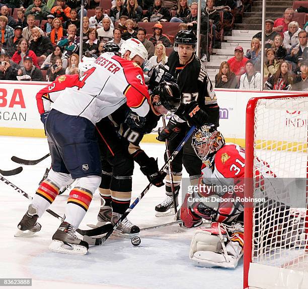 Jay Bouwmeester and Craig Anderson of the Florida Panthers stops a goal from Corey Perry of the Anaheim Ducks during the game on November 9, 2008 at...