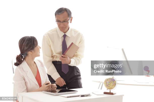 middle-aged who is consulting while laughing with notes - campeonato do mundo de 2014 fotografías e imágenes de stock