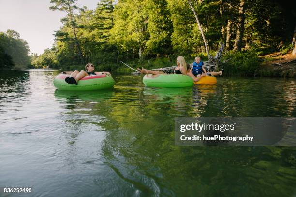 tubing in river - river tubing stock pictures, royalty-free photos & images