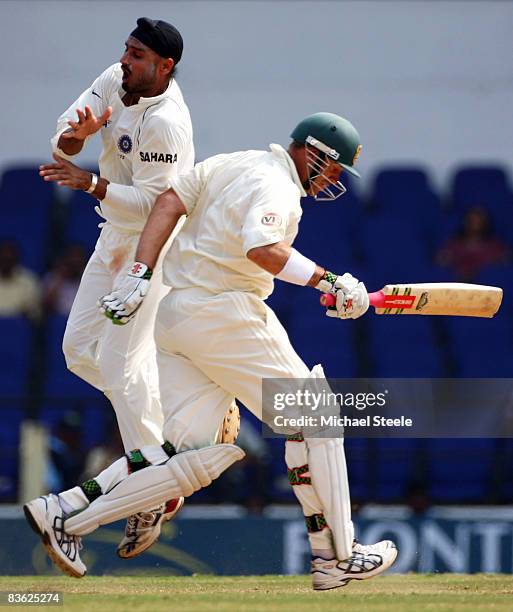 Matthew Hayden of Australia collides with Harbhajan Singh of India as he runs down the wicket during day five of the Fourth Test match between India...