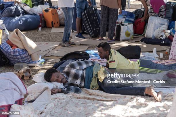 Evicted refugee sleeps on cardboard in parks in front vacated palace in Piazza Indipendenza by the police on August 21, 2017 in Rome, Italy. From...