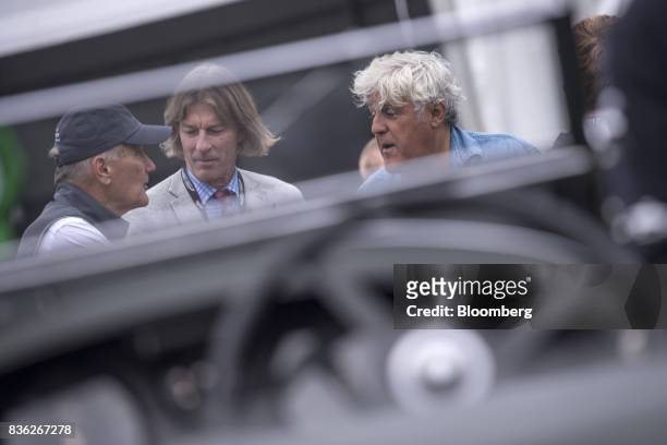 Entertainer Jay Leno, right, speaks with attendees during the 2017 Pebble Beach Concours d'Elegance in Pebble Beach, California, U.S., on Sunday,...