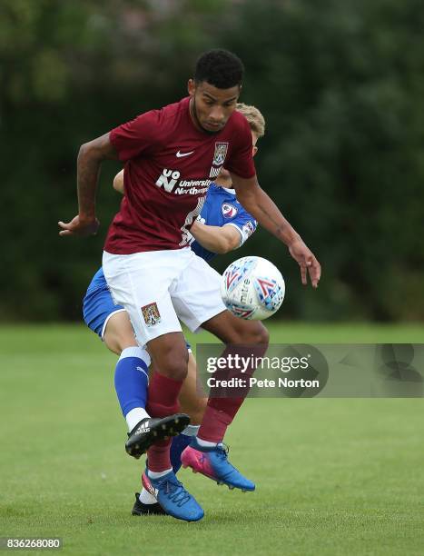 Leon Lobjoit of Northampton Town looks to control the ball under pressure from Charlie Wakefield of Chesterfield during the Reserve Match between...