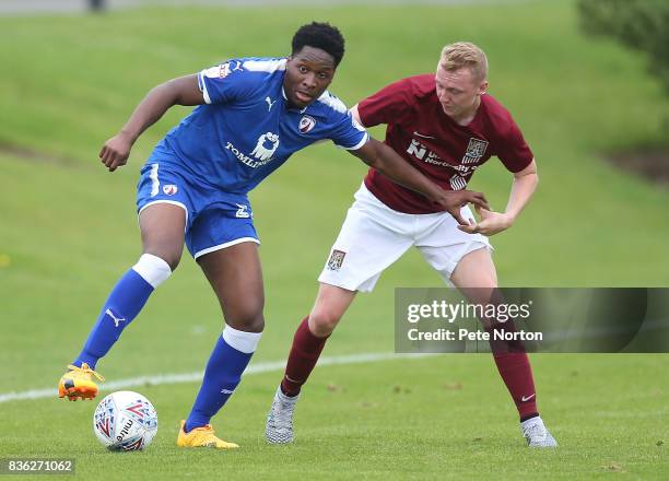 Ricky German of Chesterfield controls the ball under pressure from Jarvis Wilson of Northampton Town during the Reserve Match between Northampton...