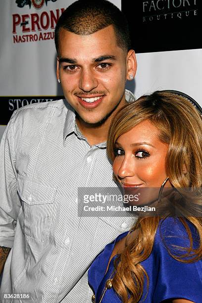 Robert Kardashian and recording artist Adrienne Bailon of the Cheetah Girls arrive at the Fashion Factory Boutique Grand Opening Celebration on May...