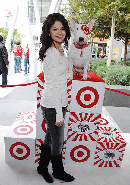 Actress Selena Gomez poses for a photo with BullsEye at 'Target Presents Variety's Power of Youth' event held at NOKIA Theatre L.A. LIVE on October...