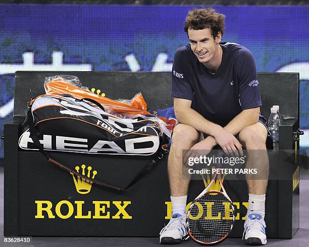 Andy Murray of Britain smiles following his victory over Andy Roddick of the US in their singles match on the second day of the ATP Masters Cup...