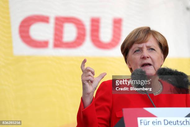 Angela Merkel, Germany's chancellor and Christian Democratic Union leader, speaks during an election campaign stop in Saint Peter-Ording, Germany, on...