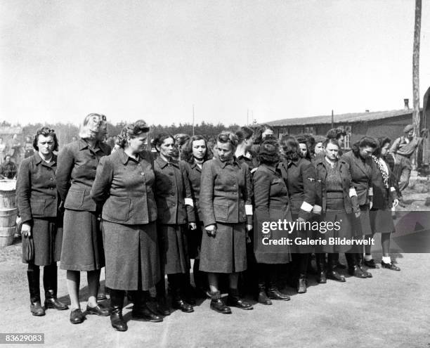 Female overseers at Bergen-Belsen concentration camp, having been taken prisoner by the British, 17th April 1945. 60,000 civilian prisoners, many...