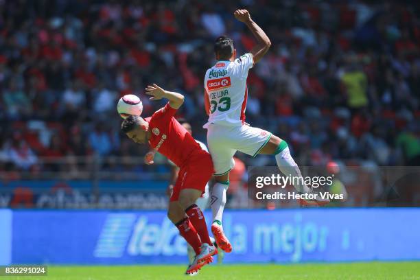 Mario de Luna of Necaxa struggles for the ball with Gabriel Hauche of Toluca during the fifth round match between Toluca and Necaxa as part of the...