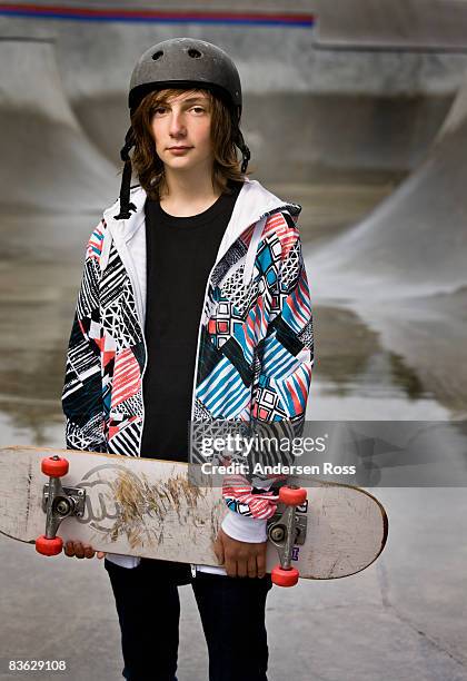 portrait of young boy at a skate park with a skate - boy with long hair stock pictures, royalty-free photos & images