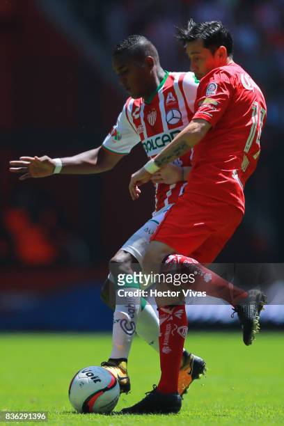 Brayan Beckeles of Necaxa struggles for the ball with Rubens Sambueza of Toluca during the fifth round match between Toluca and Necaxa as part of the...