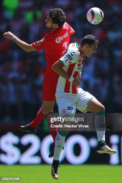 Santiago Garcia of Toluca struggles for the ball with Pablo Velazquez of Necaxa during the fifth round match between Toluca and Necaxa as part of the...