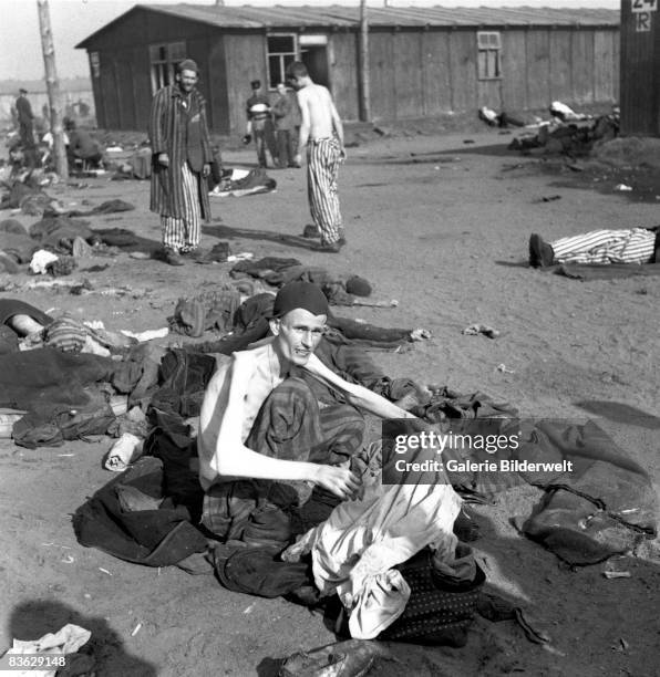 Prisoners at Bergen-Belsen concentration camp after the transfer of the neutral territory of the camp to the British army, April 1945. 60,000...