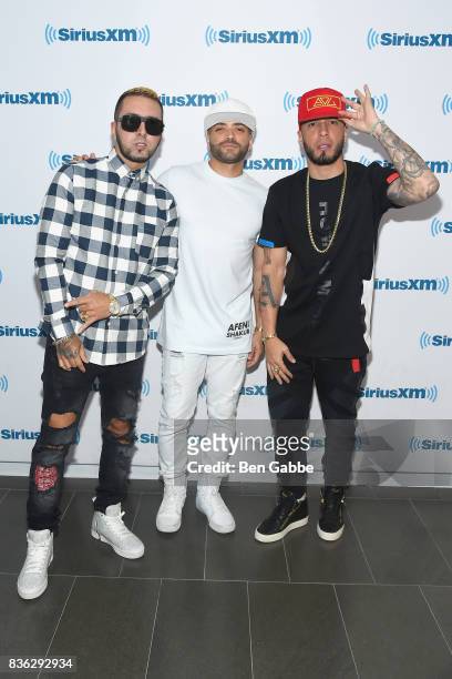 Reggaeton duo Fido and Alexis of 'Alexis Y Fido' with singer Nacho at SiriusXM Studios on August 21, 2017 in New York City.