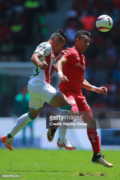 Mario de Luna of Necaxa struggles for the ball with Fernando Uribe of Toluca during the fifth round match between Toluca and Necaxa as part of the...