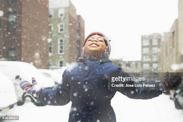 little boy enjoying snowfall - day 4 stockfoto's en -beelden