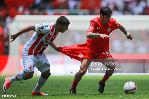 Jairo Gonzalez of Necaxa struggles for the ball with Rubens Sambueza of Toluca during the fifth round match between Toluca and Necaxa as part of the...