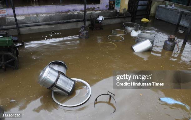 Utensils floating in water after heavy rains at Gaushala at Sector 45 on August 21 2017 in Chandigarh, India. Heavy rainfall on morning brought the...