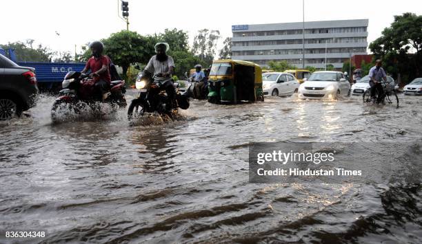 Traffic moving in waterlogged road at 32-33 light point due to rain on August 21, 2017 in Chandigarh, India. Heavy rainfall on morning brought the...
