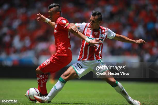 Fernando Uribe of Toluca struggles for the ball with Mario de Luna of Necaxa during the fifth round match between Toluca and Necaxa as part of the...