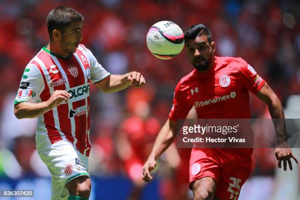 Jairo Gonzalez of Necaxa struggles for the ball with Pedro Canelo of Toluca during the fifth round match between Toluca and Necaxa as part of the...