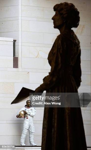 Statues of former Rep. Jeannette Rankin of Montana, and former astronaut John L. "Jack" Swigert, Jr. Are seen on display in the Emancipation Hall...
