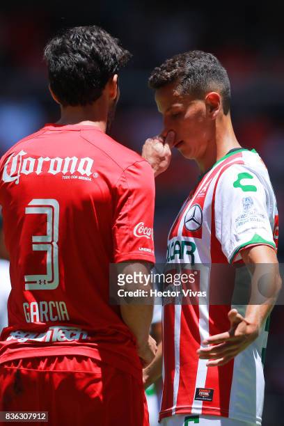 Santiago Garcia of Toluca touches the nose of Igor Lichnovsky of Necaxa during the fifth round match between Toluca and Necaxa as part of the Torneo...