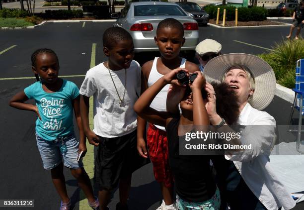 Holiday Inn hosts an Eclipse viewing party with Scholastic as part of the culmination event to the "Summer of Smiles" program on August 21, 2017 in...