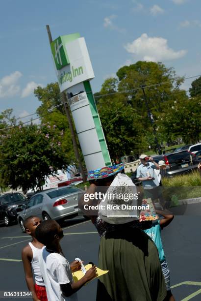 Holiday Inn hosts an Eclipse viewing party with Scholastic as part of the culmination event to the "Summer of Smiles" program on August 21, 2017 in...