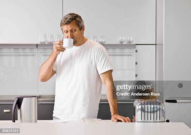 Guy Using Toaster Photos and Premium High Res Pictures - Getty Images