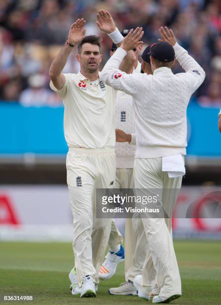 James Anderson of England celebrates taking the wicket of Roston Chase of West Indies during day three of the 1st Investec test match between England...
