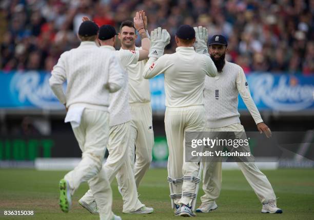 James Anderson of England celebrates taking the wicket of Kieran Powell of West Indies during day three of the 1st Investec test match between...