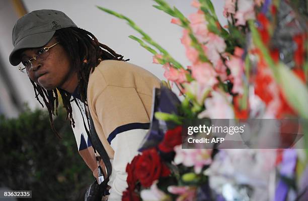 Fan and friend of international singing star Miriam Makeba mourns on November 10, 2008 at the hospital Pineta Grande in Castelvolturno, near Naples...